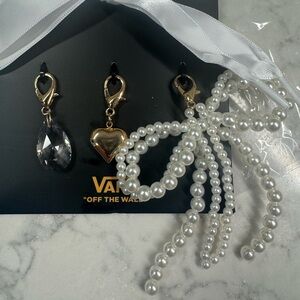 Vans shoe charms and white ribbon laces